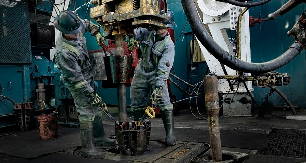 oil workers on rig floor