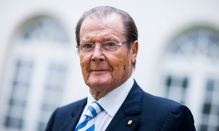 25 Jun 2013, Aachen, Germany --- British actor Sir Roger Moore poses before an interview in Aachen, Germany, 25 June 2013. Photo: ROLF VENNENBERND --- Image by © Rolf Vennenbernd/dpa/Corbis